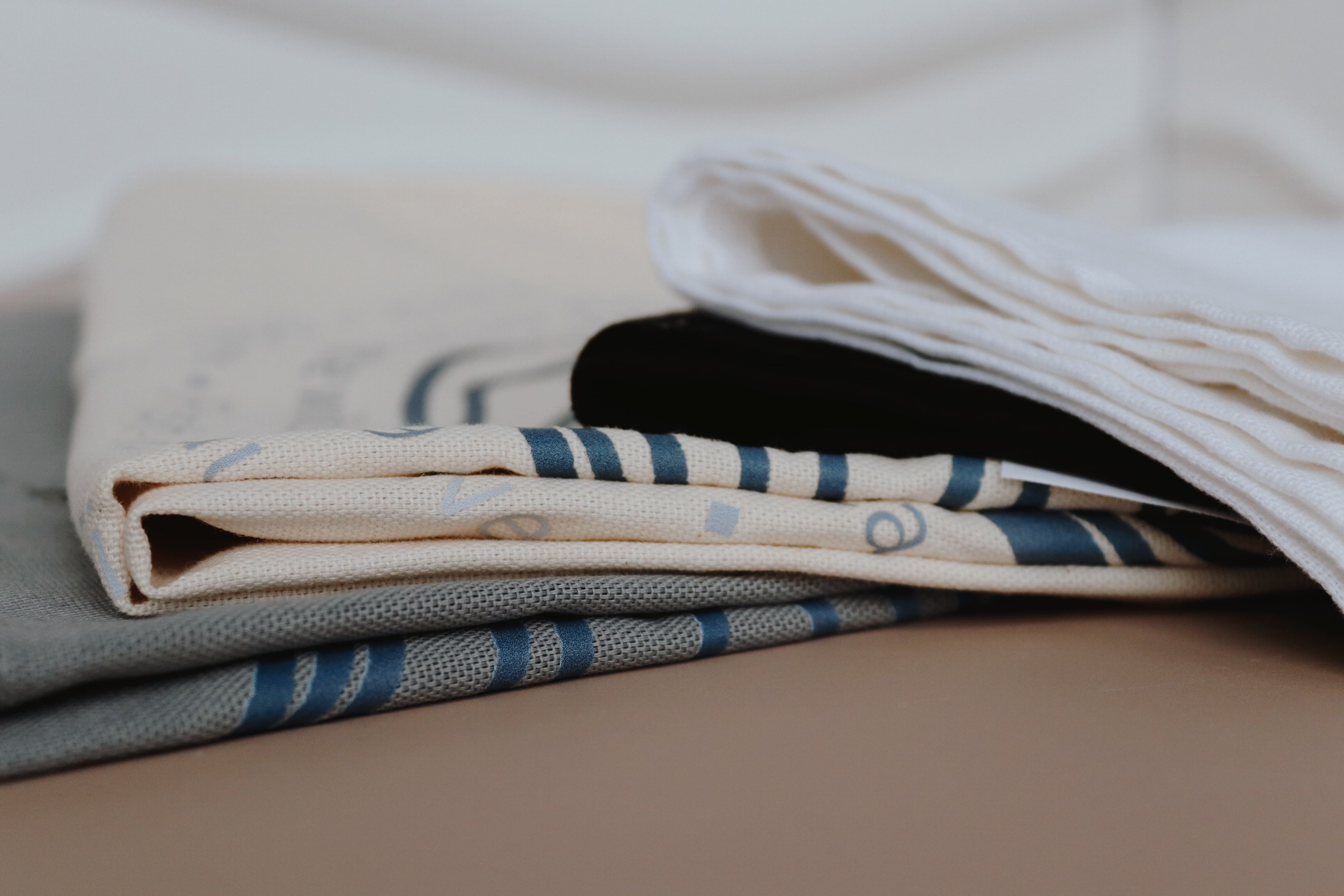 Selection of shucking tea towels sold by Richard Haward's Oysters 