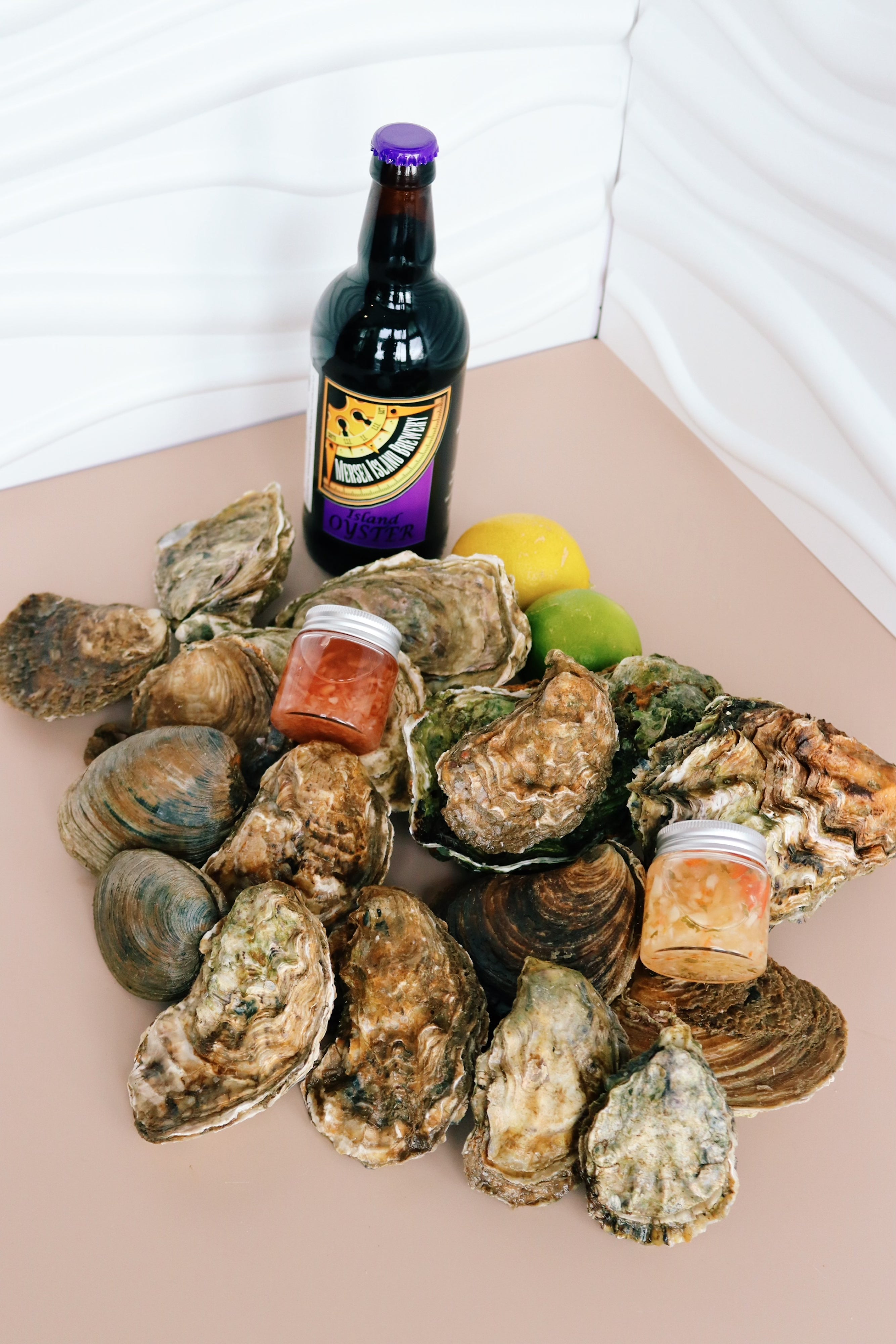 Oyster selection box from the creeks of Mersea Island with a bottle of oyster stout. 