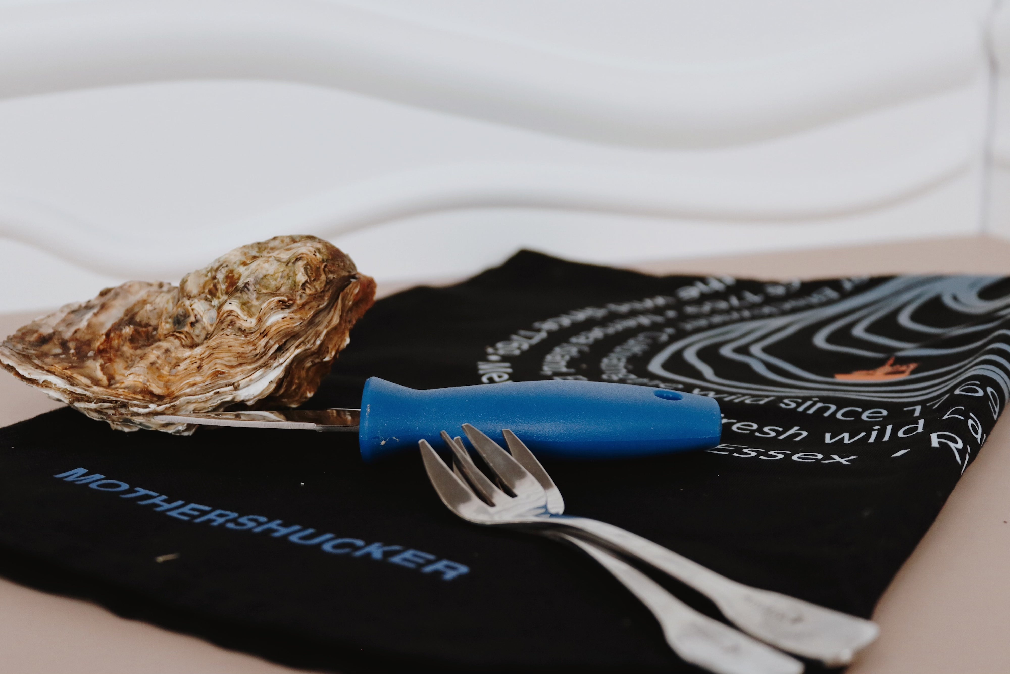 Black shucking bundle. Oyster forks. Shucking knife. 