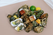 Load image into Gallery viewer, Mersea and Jersey Oysters on a bed of lemons and limes 